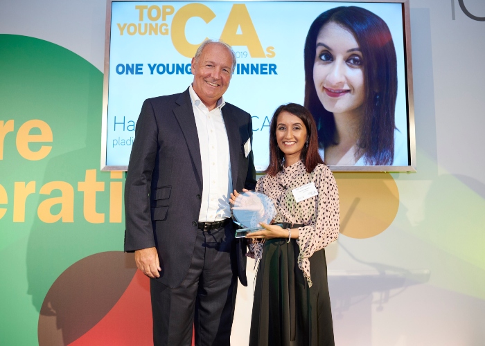 Hamisha Mehta receives the One Young CA Awards from ICAS President Mike McKeon