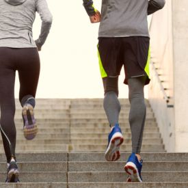 photo of man and woman jogging